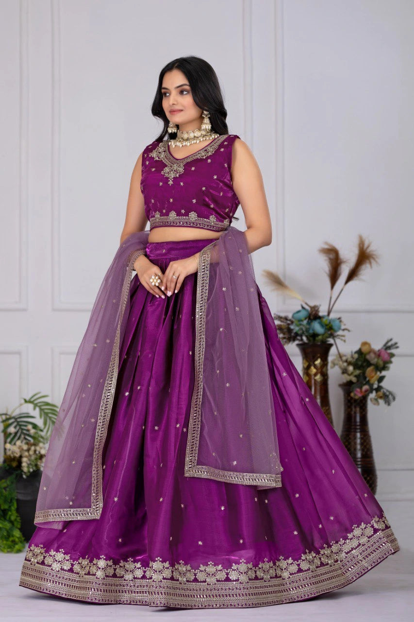 Woman wearing a purple traditional outfit with a white background